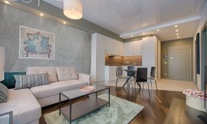 sala de estar com parede de cimento queimado
